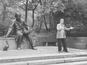 Lucy Duncan telling stories in Central Park in New York City in the summer of 2012 as part of the series Stories at the Statue of Hans Christian Andersen.