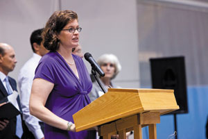 The author offering the benediction at a recent graduation.