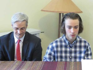 The author's son, Aaron, playing the piano alongside his instructor Joe Trainer following worship at Wilmington (De.) Meeting.