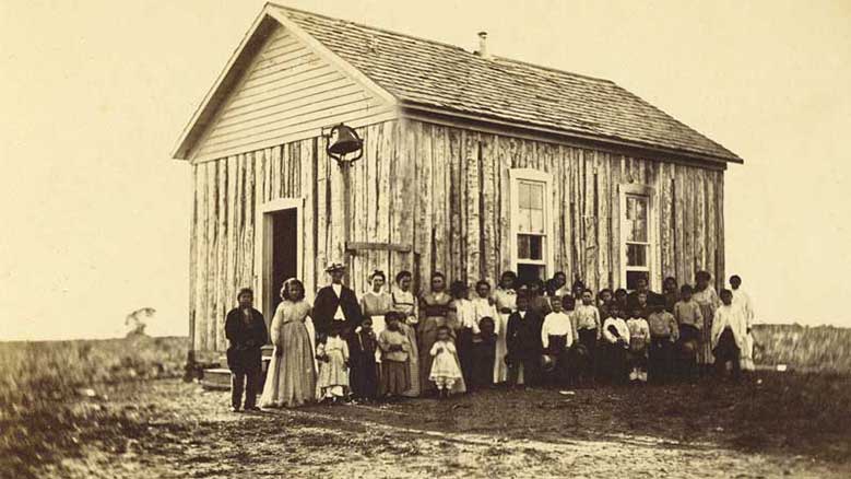 Quaker teachers, families, and students at the Ottawa School, Indian Territory, 1872. Courtesy of the Quaker Collection at Haverford College.