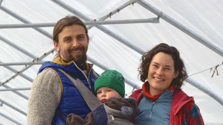 The author with his wife and child in a tent.
