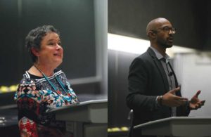 Two people speaking at a conference.