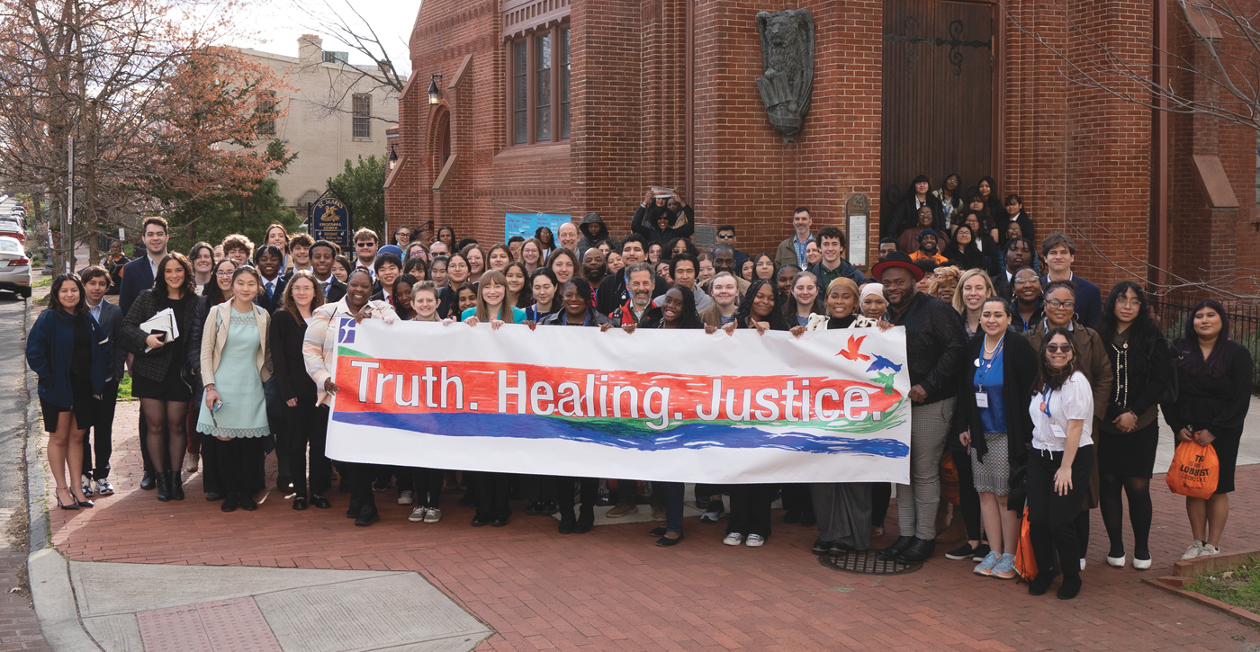 FCNL’s 2024 Spring Lobby - Group Holding Truth Healthing Justice Sign