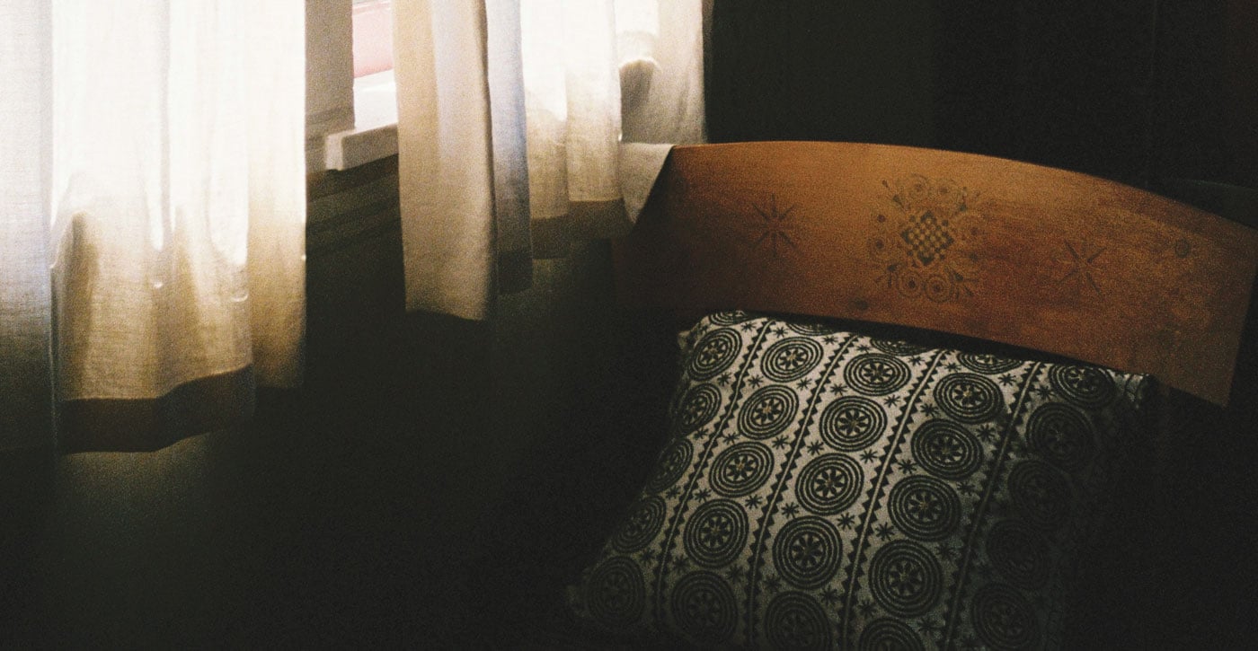 wooden furniture with decorative pillow
